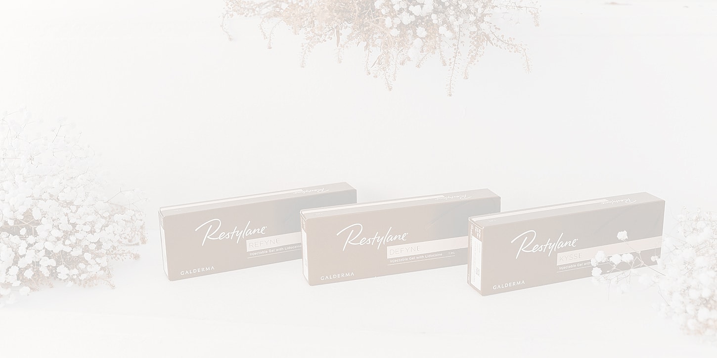Restylane product boxes with decorative flowers.